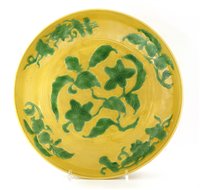 Lot 73 - A Chinese yellow ground and green enamelled plate