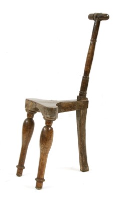 Lot 575 - An unusual, primitive, three-legged 'Cockfighting' chair