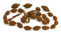 Lot 277 - Two sets of Chinese carved nuts
