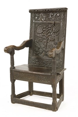 Lot 831 - An oak armchair