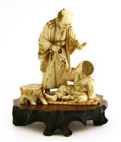 Lot 347 - A Japanese ivory okimono