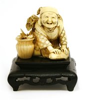 Lot 348 - A Japanese ivory okimono