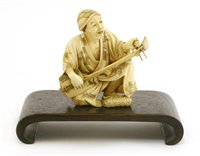 Lot 350 - A Japanese ivory okimono