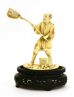 Lot 352 - A Japanese ivory okimono