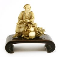 Lot 353 - A Japanese ivory okimono