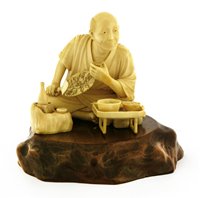 Lot 354 - A Japanese ivory okimono