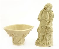 Lot 99 - A Chinese blanc de Chine wine cup and a figure