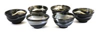 Lot 409 - A collection of six Chinese agate tea bowls