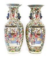 Lot 84 - A pair of Chinese Canton famille rose vases