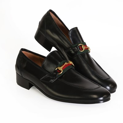 Lot 1489 - A pair of Gucci men's black leather loafers