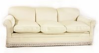 Lot 558 - A modern three-seater settee