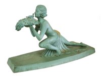Lot 214A - An Art Deco painted terracotta figure of a lady and a dove
