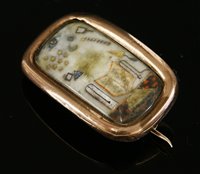Lot 2 - A Georgian gold cased masonic brooch of elongated cushion form