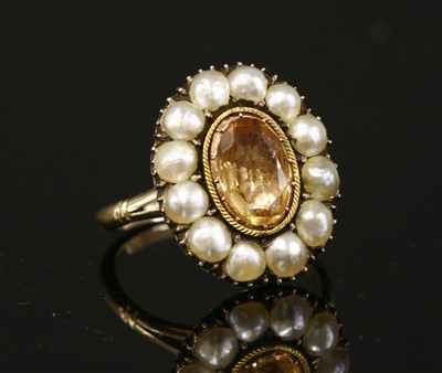 Lot 16 - A Georgian foiled topaz and split pearl cluster