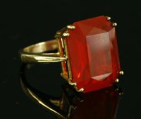 Lot 210 - A 9ct gold single stone fire opal ring