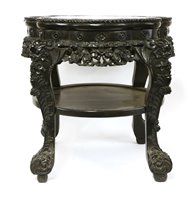 Lot 317 - A Chinese hardwood vase stand