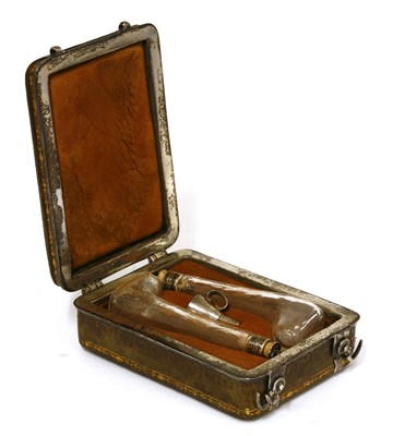 Lot 150 - A leather-cased pair of cut glass scent bottles