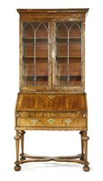 Lot 537 - A walnut bureau bookcase