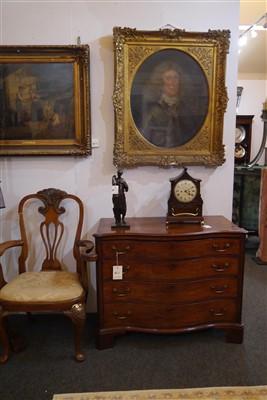 Lot 655 - A George III mahogany serpentine commode chest