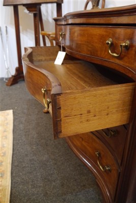 Lot 655 - A George III mahogany serpentine commode chest