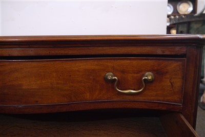 Lot 655 - A George III mahogany serpentine commode chest