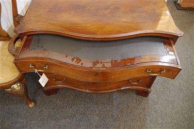Lot 655 - A George III mahogany serpentine commode chest