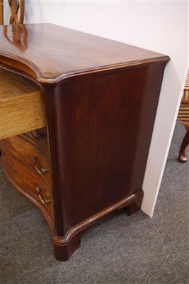 Lot 655 - A George III mahogany serpentine commode chest