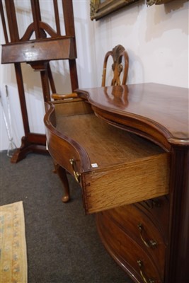 Lot 655 - A George III mahogany serpentine commode chest