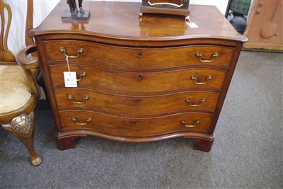 Lot 655 - A George III mahogany serpentine commode chest