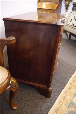 Lot 655 - A George III mahogany serpentine commode chest