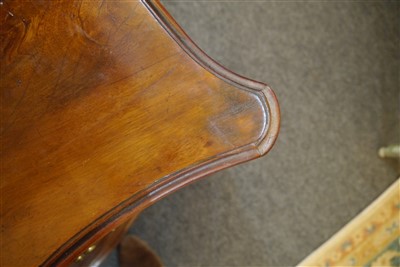 Lot 655 - A George III mahogany serpentine commode chest