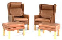 Lot 394 - A pair of leather armchairs