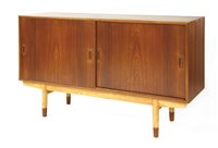 Lot 561 - A Danish teak cabinet