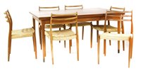 Lot 489 - A Danish teak draw leaf table