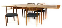 Lot 491 - A Danish teak draw leaf table