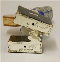 Lot 80 - A Goldscheider figure of a woman holding a hat box, holding two suitcases