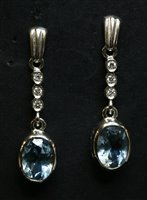 Lot 431 - A pair of 18ct white gold aquamarine and diamond drop earrings
