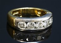Lot 271 - An 18ct gold diamond set half hoop ring