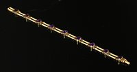 Lot 98 - An Edwardian gold amethyst bracelet