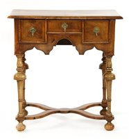 Lot 504 - A walnut lowboy