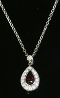 Lot 81 - An 18ct white gold ruby and diamond cluster pendant