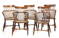 Lot 512 - An harlequin set of five early Victorian yew wood and elm Windsor chairs