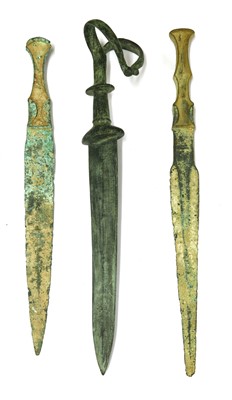 Lot 235 - Antiquities: three bronze daggers
