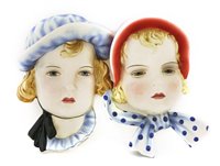 Lot 104 - Two Goldscheider pottery wall masks