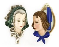 Lot 105 - Two Goldscheider pottery wall masks