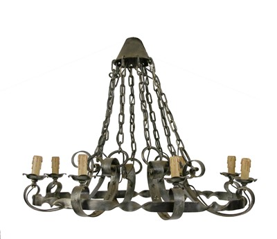 Lot 405 - A pair of wrought iron strapwork eight-light electroliers