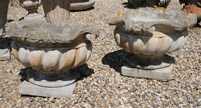 Lot 273 - A pair of composite stone lobed garden planters