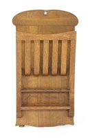 Lot 65 - An oak magazine/pipe rack