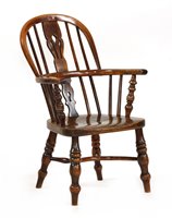 Lot 527 - A yew wood and elm child's Windsor chair