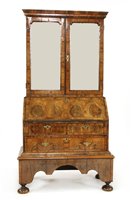 Lot 505 - A walnut, feather-banded and fruitwood bureau cabinet on stand